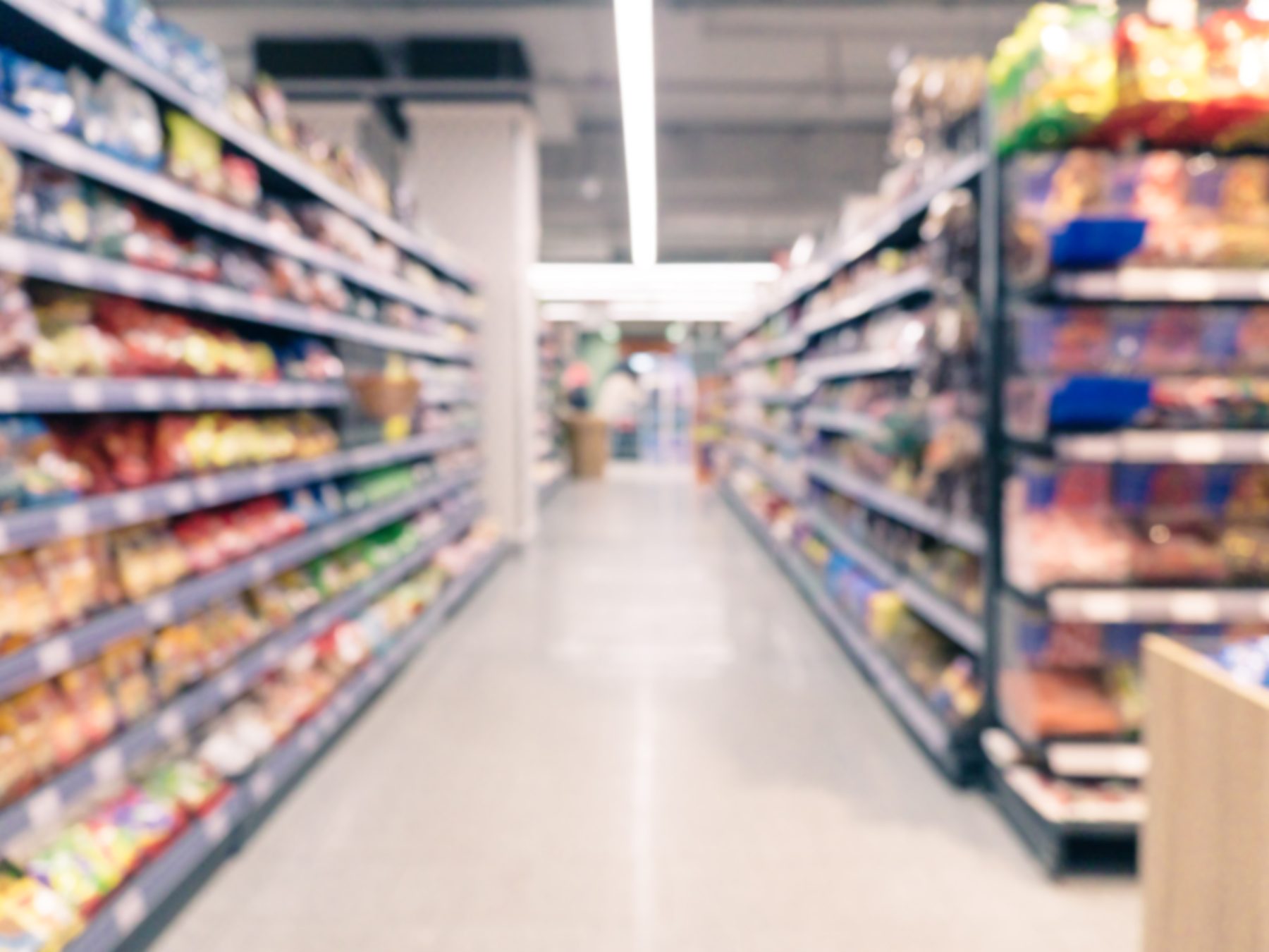 A supermarket aisle photographed out of focus