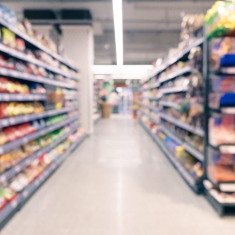A supermarket aisle photographed out of focus